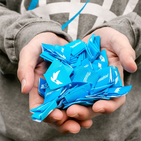Hand full of hem tags 
